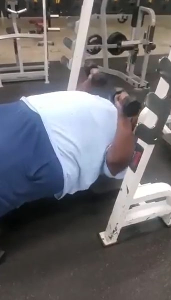Image of George Covington doing his work out routine in a low bench